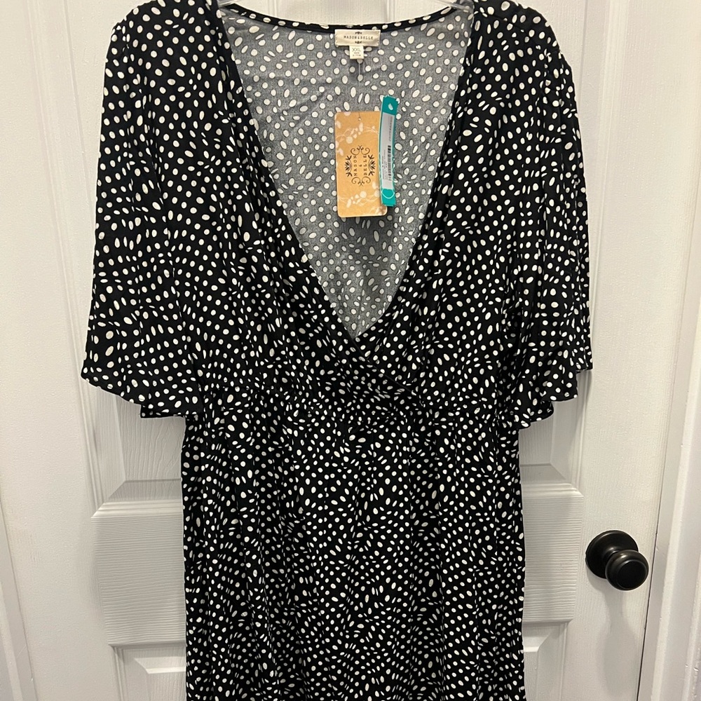 Knee length polka dot dress.
